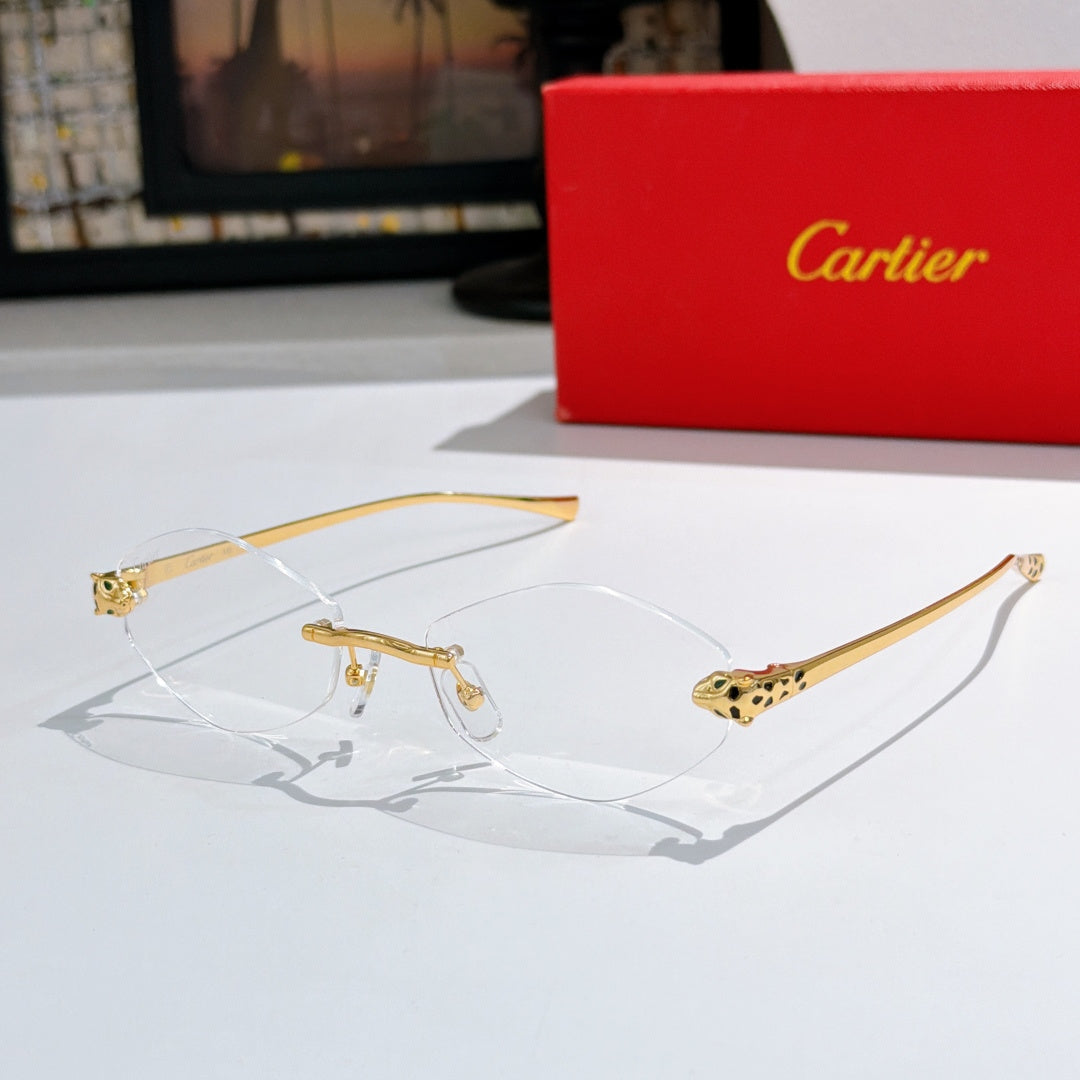 Clear-lens eyeglasses with gold-tone frames and patterned temple accents