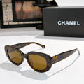 Chanel sunglasses, tortoiseshell frame with amber tinted lenses and curved arms