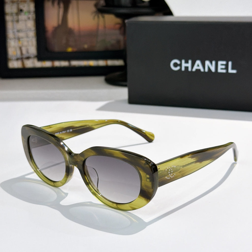 Chanel sunglasses, olive-green frame with light lenses and slim curved arms