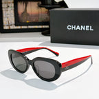 Chanel sunglasses, black frame with red temples and dark tinted lenses