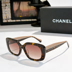 Tortoise square sunglasses with pink tinted lenses, logo on side temples