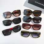 Assorted square sunglasses with dark, tortoise, red, and olive frames, logo temples