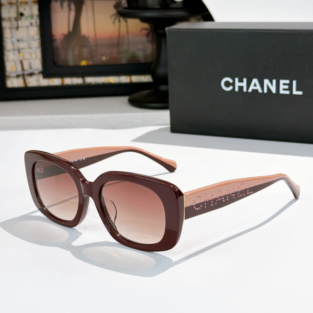 Brown square sunglasses with rose tinted lenses, logo on side temples