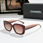 Brown square sunglasses with rose tinted lenses, logo on side temples