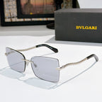 Bvlgari square sunglasses with clear gray lenses and gold chain temple arms