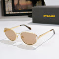 Bvlgari cat-eye glasses with gold frame and amber tinted lenses