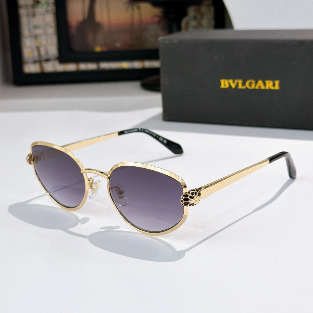 Bvlgari cat-eye glasses with gold frame and purple tinted lenses