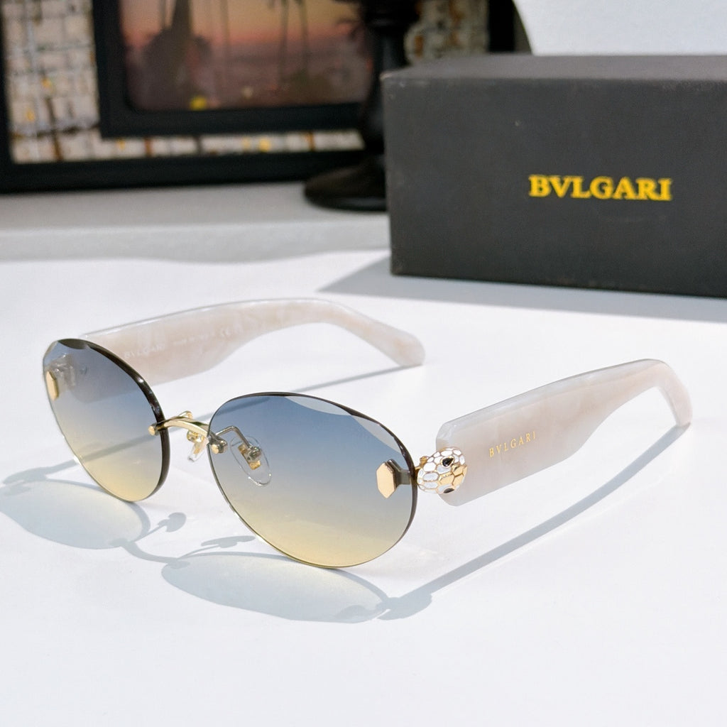 Sunglasses with clear-white temples, blue-gray lenses, gold-tone frame