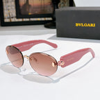 Sunglasses with pink temples, rose-brown lenses, gold-tone frame