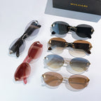 Assorted sunglasses with dark, red, and brown lenses, gold-tone frames