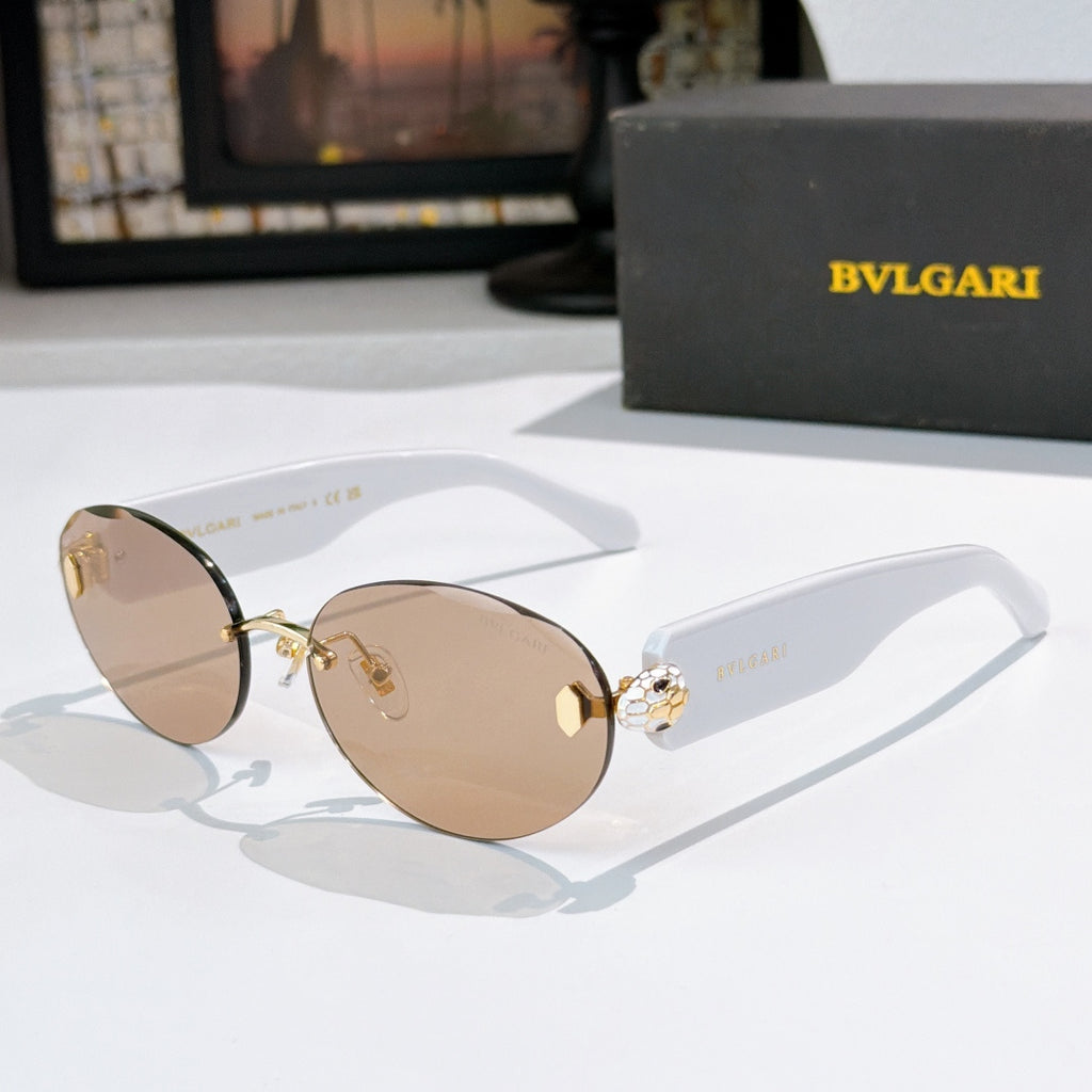 Sunglasses with tan lenses and light brown temples, gold-tone frame