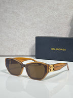 Sunglasses with tortoiseshell frames, brown lenses, and gold B emblem