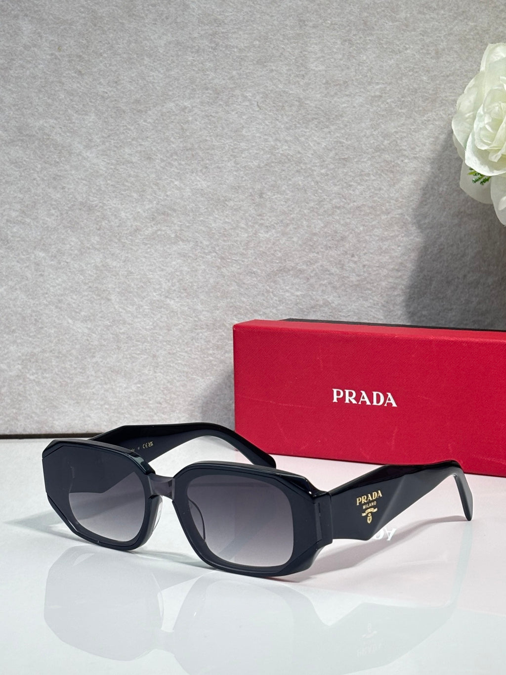 Prada sunglasses with black oversized frames and tinted lenses