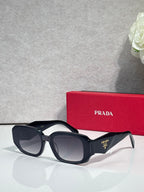 Prada sunglasses with black oversized frames and tinted lenses