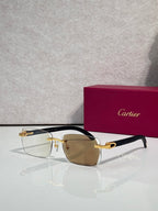 Cartier glasses, black and gold frame with amber-tinted lenses
