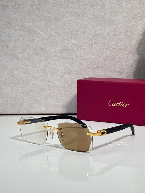 Cartier glasses, black and gold frame with amber-tinted lenses