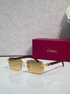 Cartier glasses, dark-brown frame with gold detailing and amber-tinted lenses