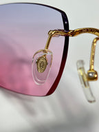 Cartier glasses frame detail with gold temple and dark lens