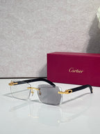 Cartier glasses, dark frame with gray-tinted lenses and gold detailing