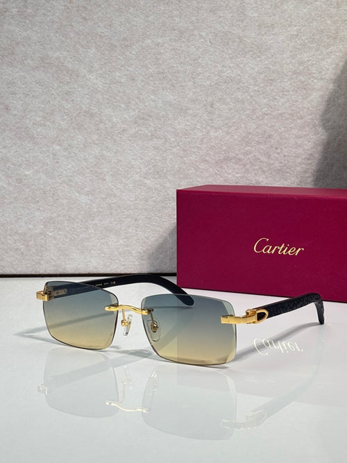 Cartier glasses with rectangular black frames and gold accents; amber-tinted lenses