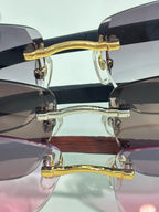 Cartier glasses close-up: gold metal bridge and temples with dark tinted lenses