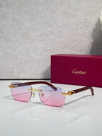 Cartier glasses with rectangular black frames, gold hinges; pink-tinted lenses