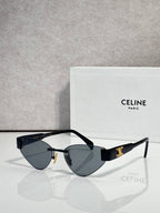 Celine glasses with gold frame, dark blue lenses, and black temple arms