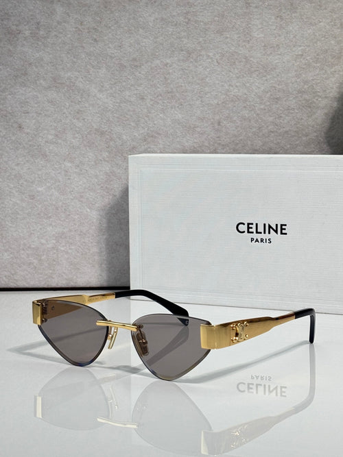 Celine glasses with gold frame, dark brown lenses, and black temple arms