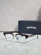 Eyeglass frames with square lenses, tortoise top rim, and gold-tone temple detail