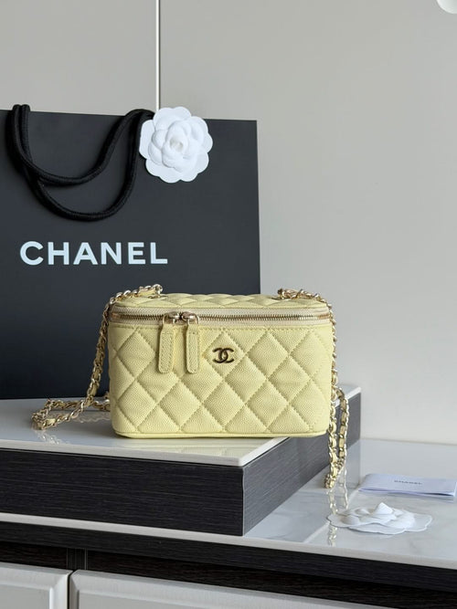 Chanel quilted mini crossbody bag in pale yellow with gold chain strap and top zipper