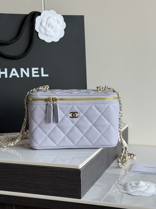 Light lavender quilted crossbody bag with gold chain strap and zipper top