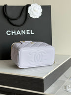 Light lavender quilted Chanel-style mini bag with CC logo flap and gold chain