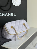 Light lavender quilted mini bag with gold chain straps and gold zipper detail