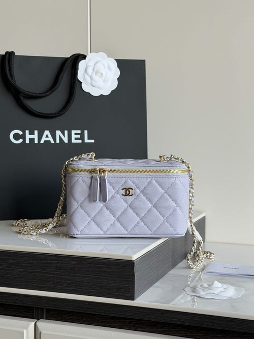 Light lavender quilted crossbody bag with gold chain, gold zipper, and CC clasp