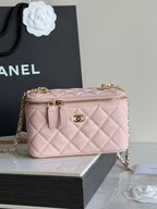 Quilted pale pink crossbody bag with gold chain strap and round CC logo.