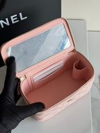 Pale pink mini shoulder bag open view showing card slots and zippered compartment.