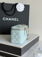 Chanel light blue quilted mini bag with gold chain strap and zip top