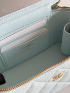 Chanel light blue wallet-style interior with card slots and Chanel logo stamp