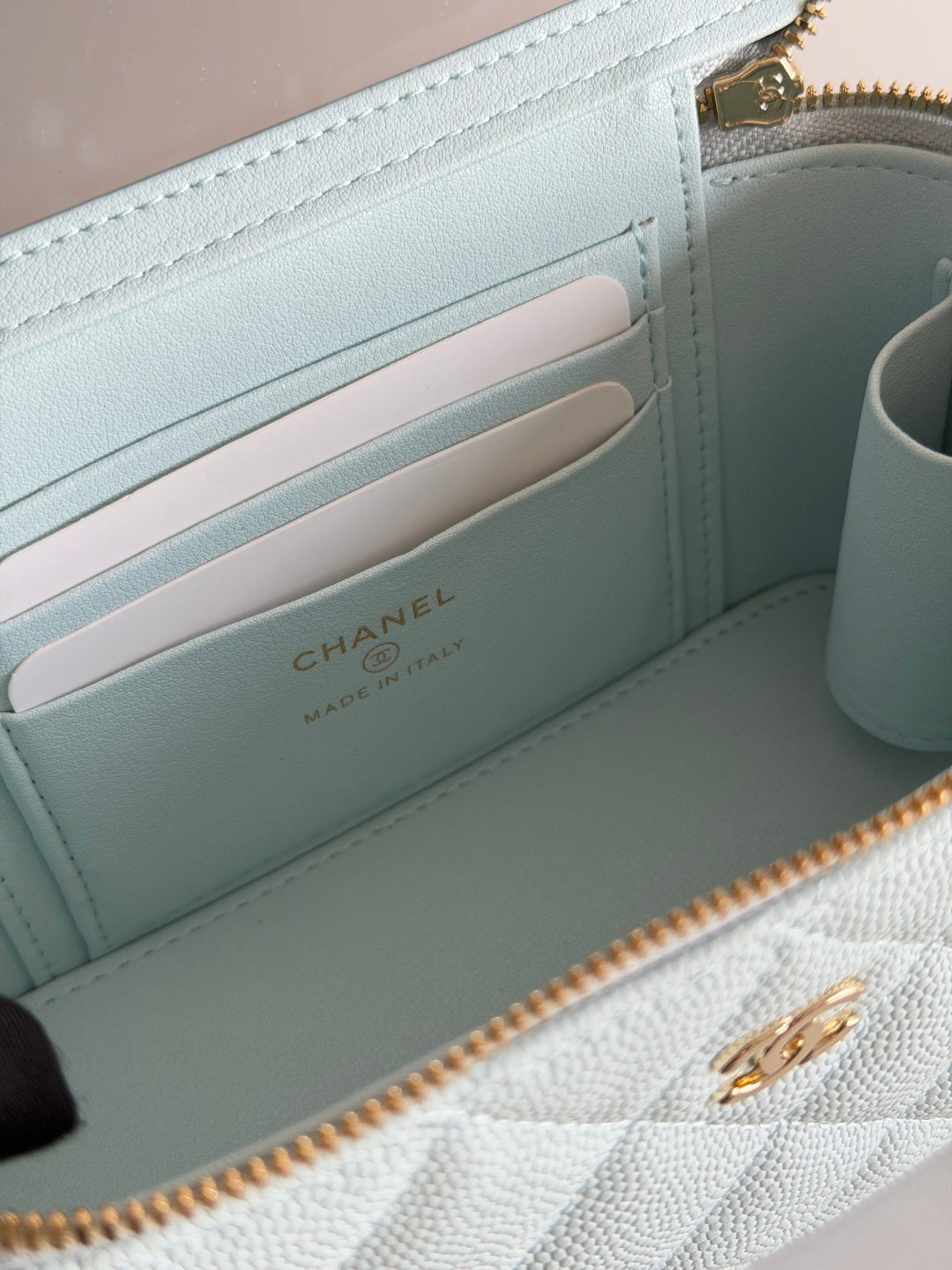 Chanel light blue wallet-style interior with card slots and Chanel logo stamp