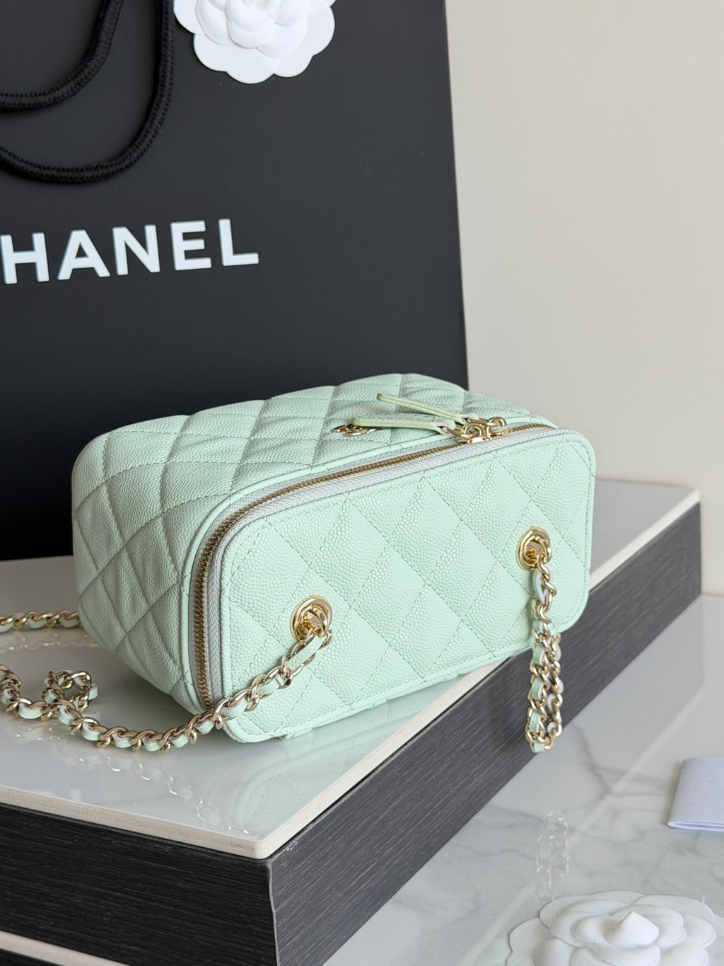 Mint quilted Chanel-style crossbody bag with front zip pocket and chain strap