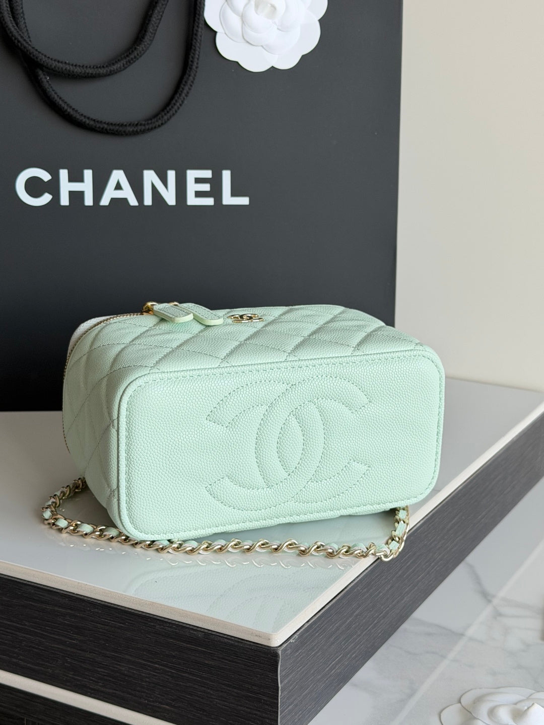 Mint quilted small crossbody bag with embossed CC logo on front and chain strap