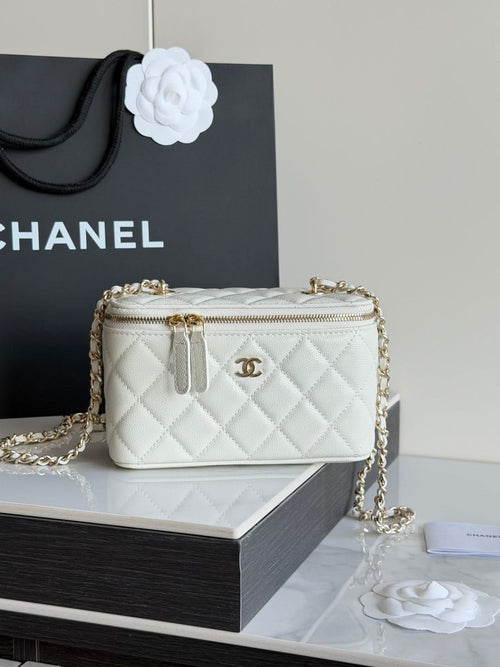 White quilted Chanel mini crossbody bag with gold chain and top zip opening