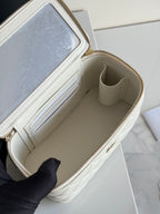 White Chanel mini bag interior with beige lining and card slots, open zip top