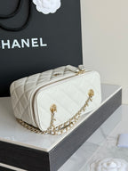 White Chanel quilted mini bag with gold chain strap and front logo hardware