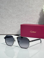 Cartier black aviator sunglasses with dark lenses and white temple accents
