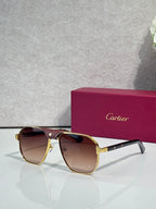 Cartier gold aviator sunglasses with amber lenses and dark temples