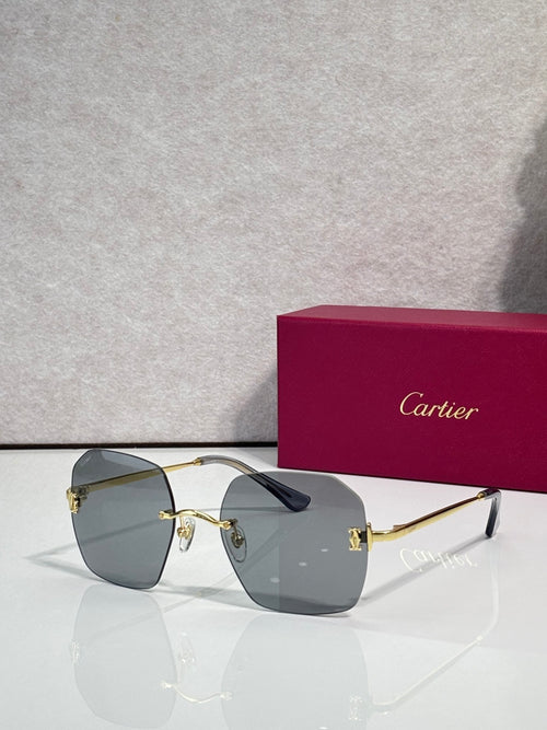 Gold-framed sunglasses with gray-green tinted lenses and sleek temple arms