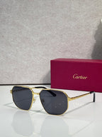 Cartier sunglasses with gold frames and dark tinted lenses