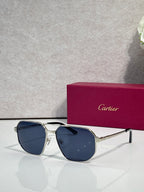 Cartier sunglasses with silver frames and dark blue tinted lenses