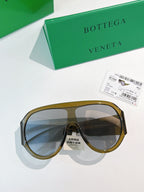 Bottega Veneta aviator sunglasses with olive-gold frames and dark lenses
